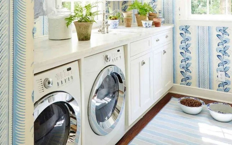 Photo of a light and rustic laundry room with wallpaper and shelves